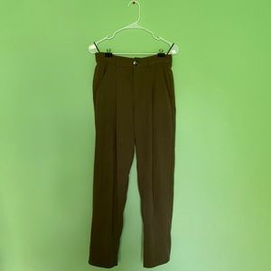 Large brown tapered trousers by Fawzia. The back pocket is fake.